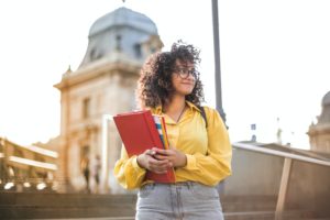 a person holding a red book