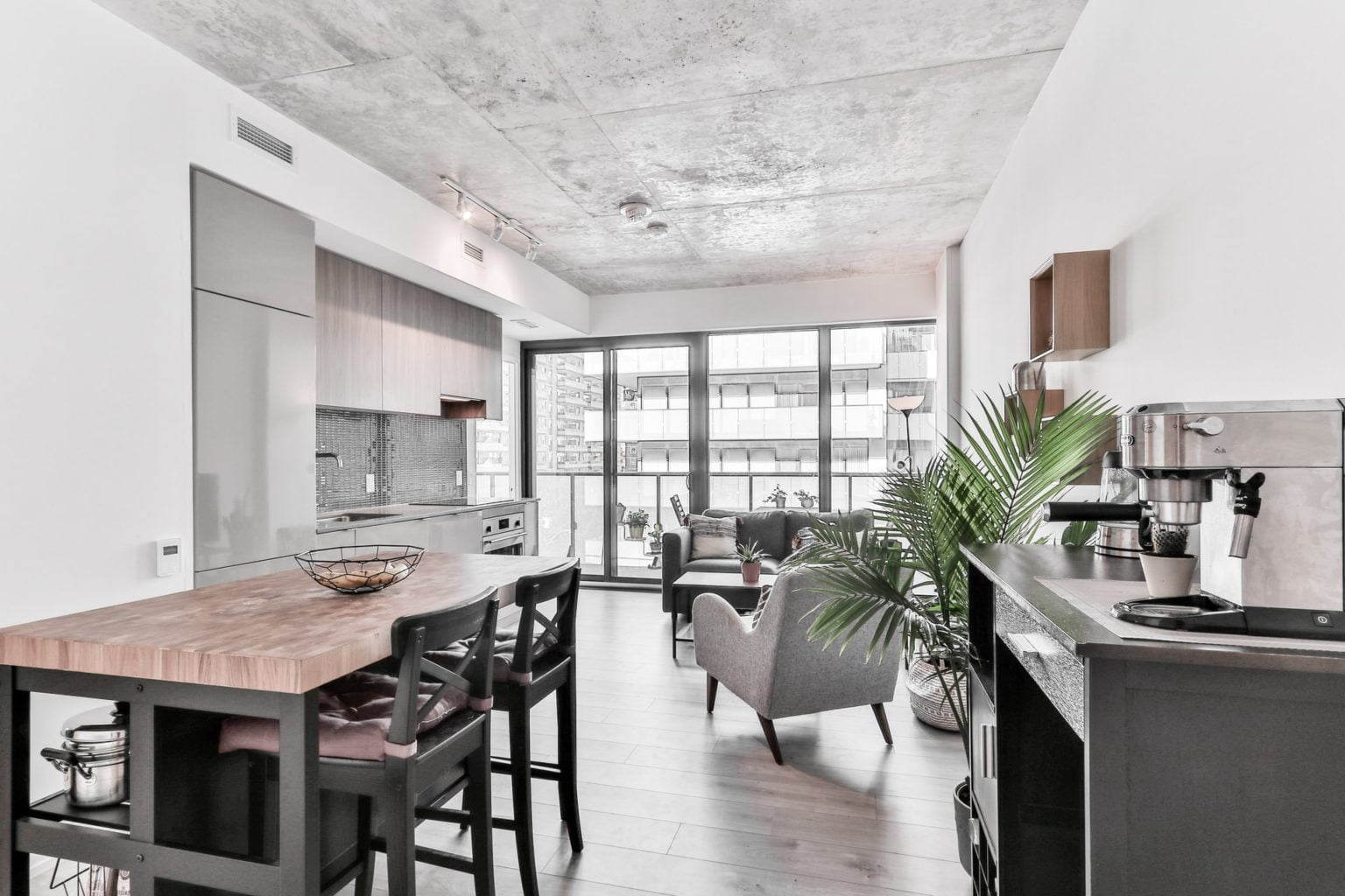 a kitchen with a table and chairs