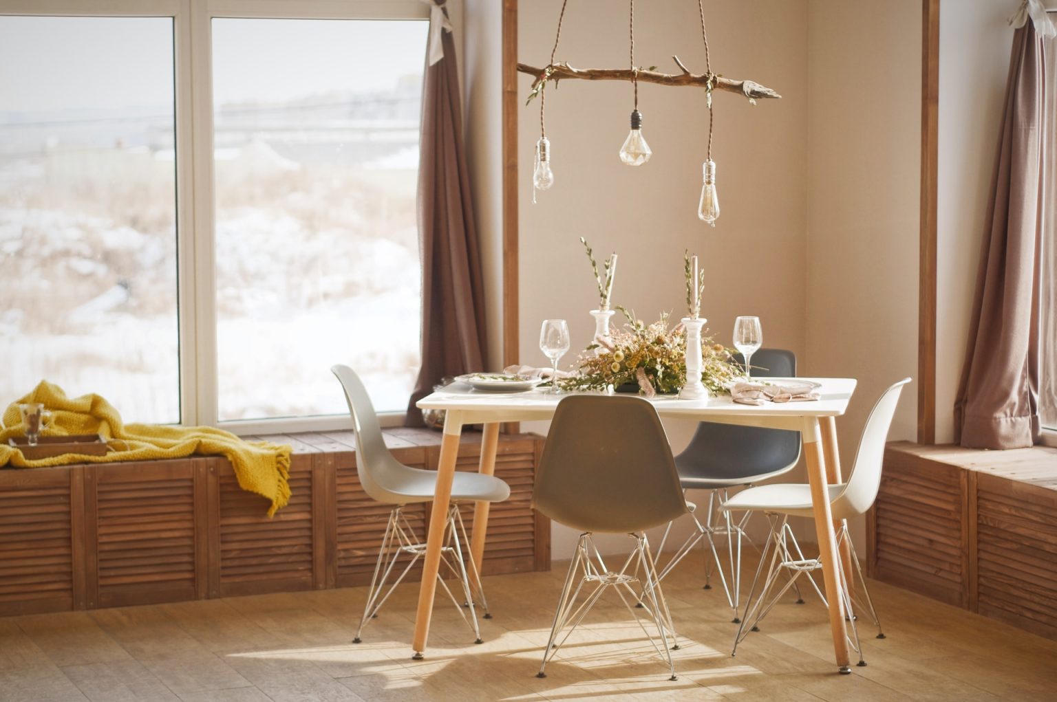 a dining room with a table and chairs