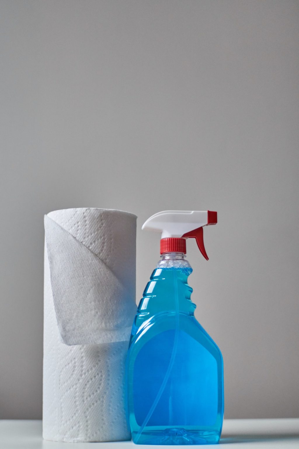 a blue bottle with a red lid