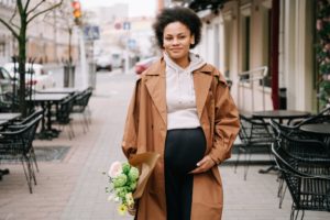 a woman walking on a sidewalk