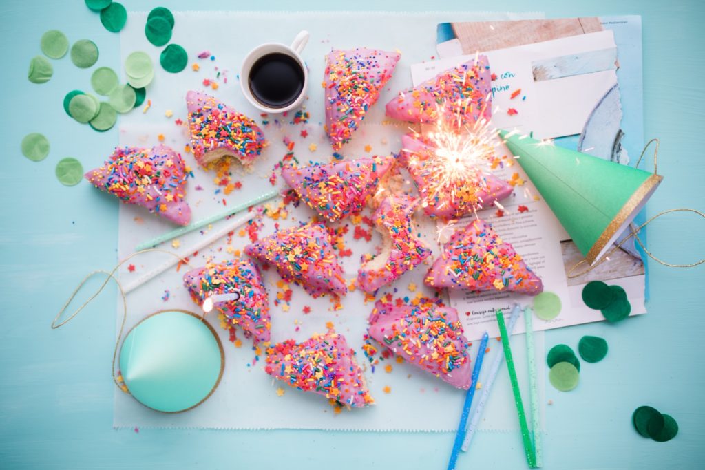 a table with a plate of food and a bowl of paint