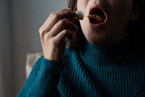 a person holding a cup
