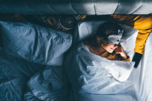 a person sleeping in a bed