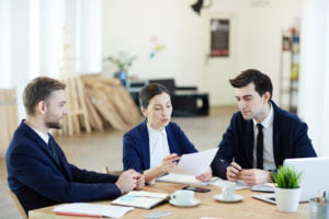 a group of people sitting around a table