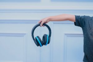 man-holding-headphone