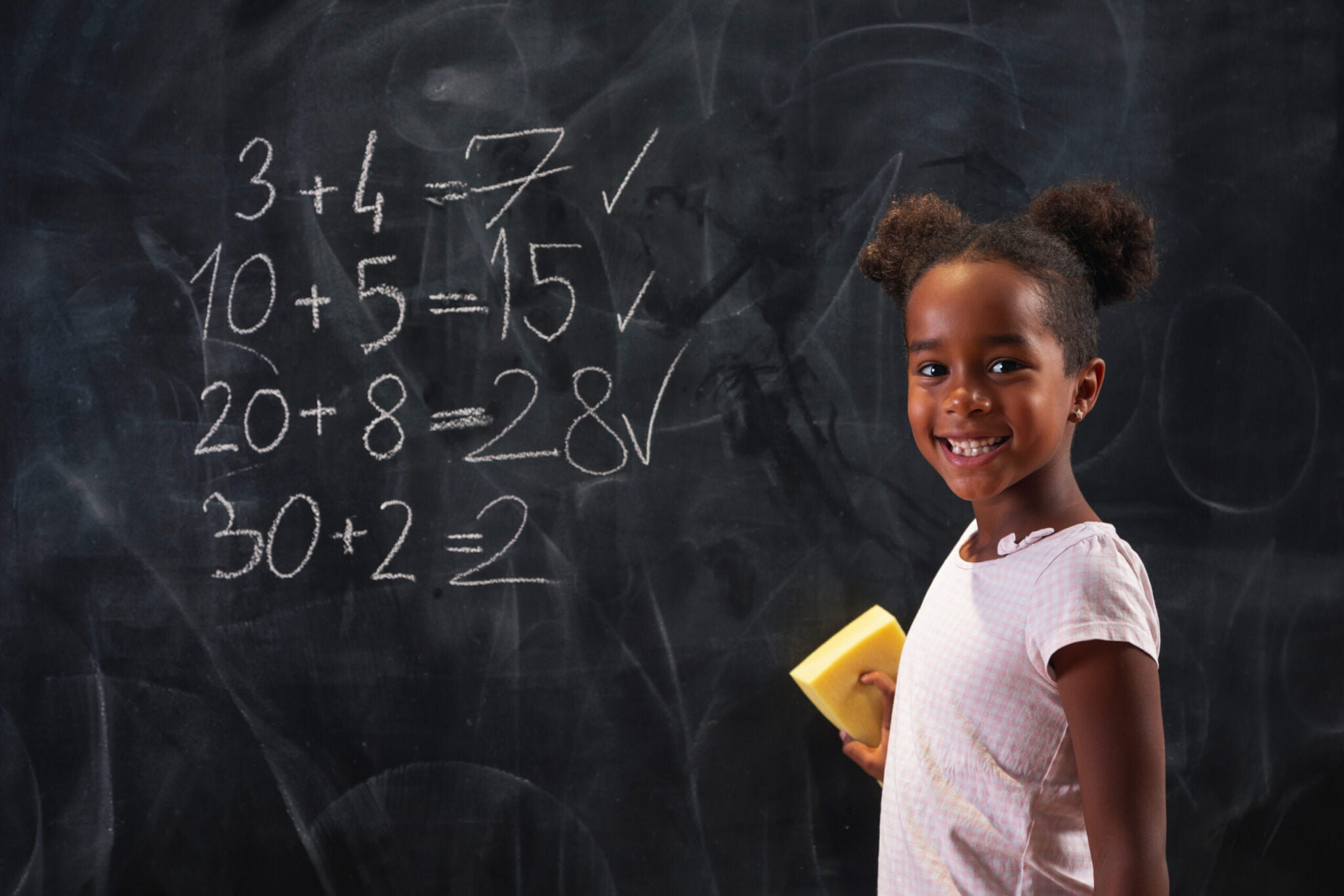 schoolgirl-doing-math-on-blackboard-2022